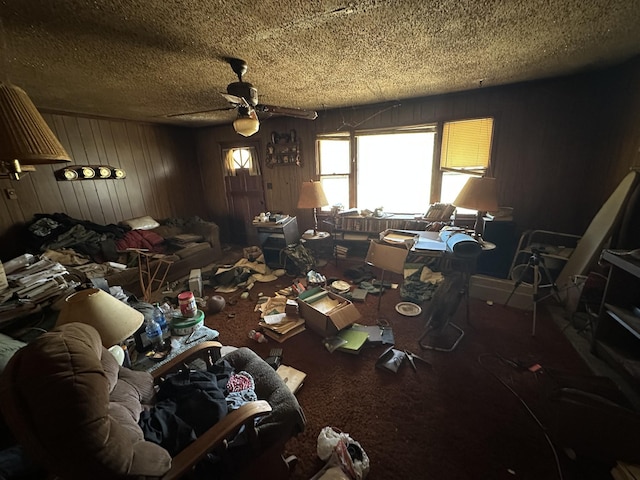 miscellaneous room featuring ceiling fan and a textured ceiling