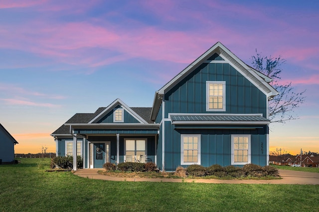 view of front of home with board and batten siding and a front yard