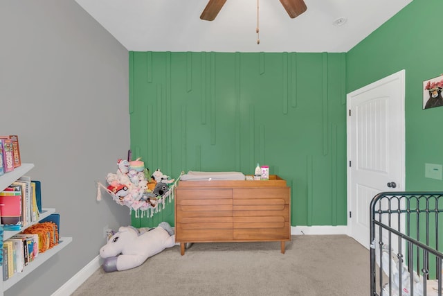 bedroom featuring carpet, baseboards, and a ceiling fan