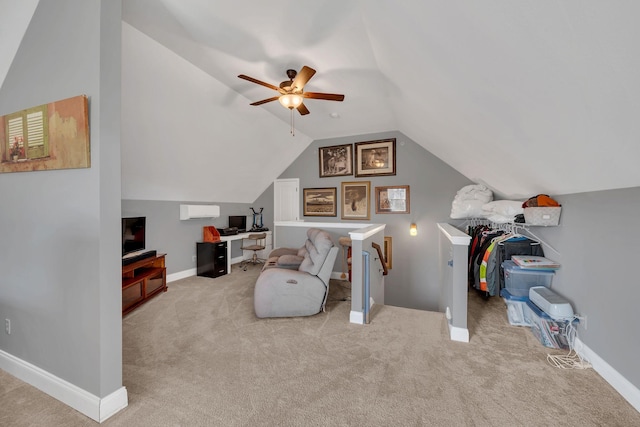 interior space featuring carpet, baseboards, and vaulted ceiling