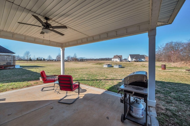 view of patio / terrace with a grill and a ceiling fan