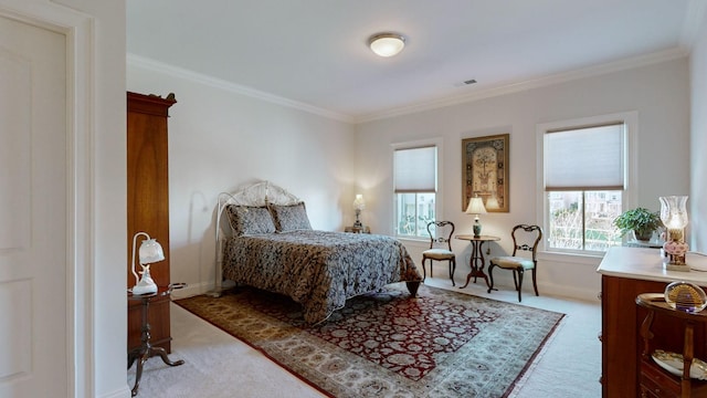 bedroom featuring baseboards, crown molding, and light colored carpet