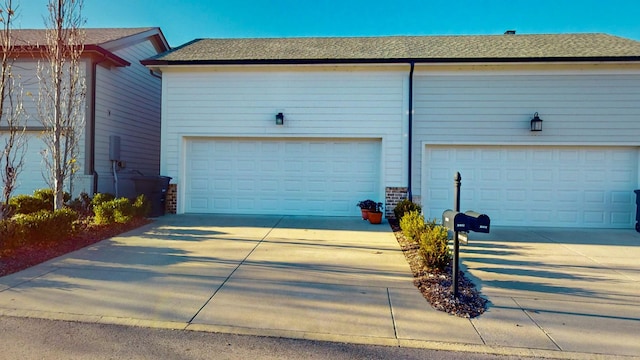 garage featuring driveway