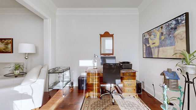 office space with baseboards, ornamental molding, and wood finished floors