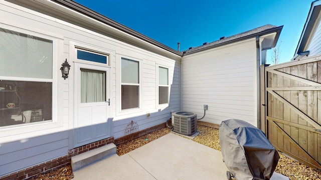 exterior space with grilling area and central air condition unit