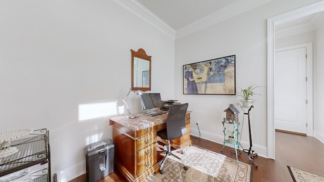 home office with ornamental molding, baseboards, and wood finished floors