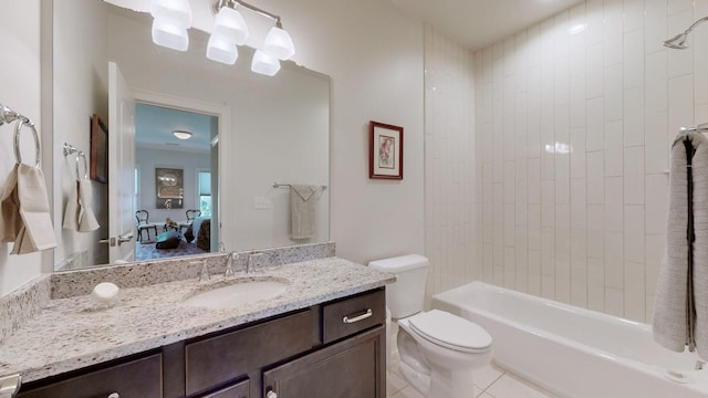 full bathroom featuring toilet, washtub / shower combination, vanity, ensuite bath, and tile patterned flooring