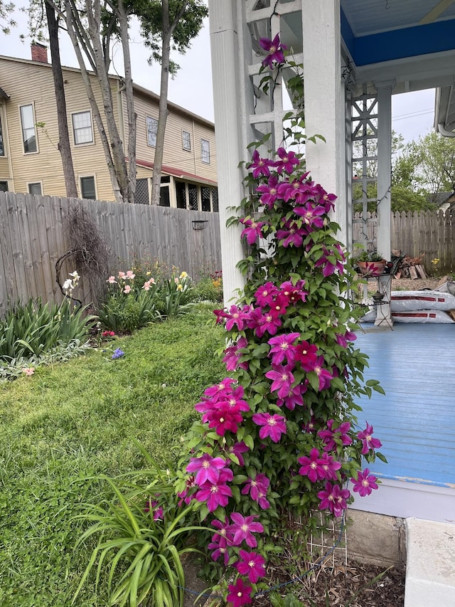 view of yard with a porch and fence