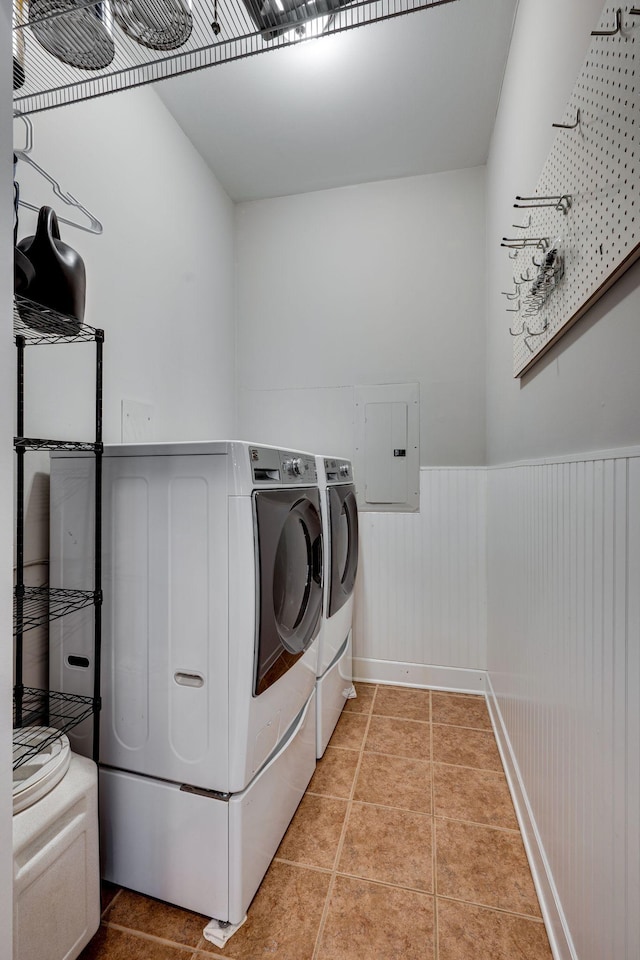 305 Seven Springs Way Unit 401, Brentwood, TN 37027 - laundry room featuring light tile patterned floors, laundry area, wainscoting, electric panel, and washer and clothes dryer