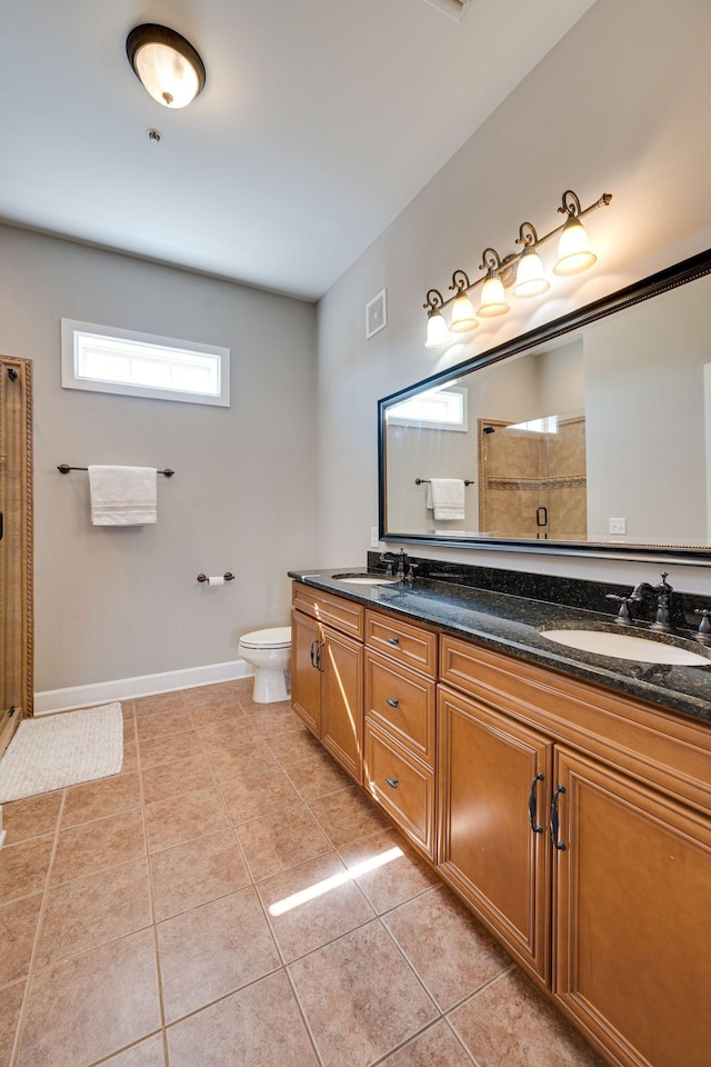 305 Seven Springs Way Unit 401, Brentwood, TN 37027 - bathroom with double vanity, toilet, a sink, tiled shower, and tile patterned floors