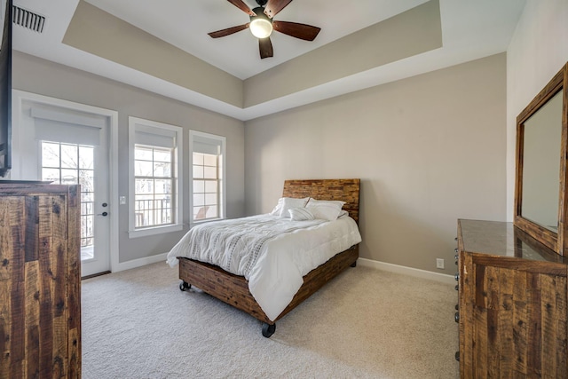 305 Seven Springs Way Unit 401, Brentwood, TN 37027 - bedroom with access to exterior, a tray ceiling, light carpet, and baseboards