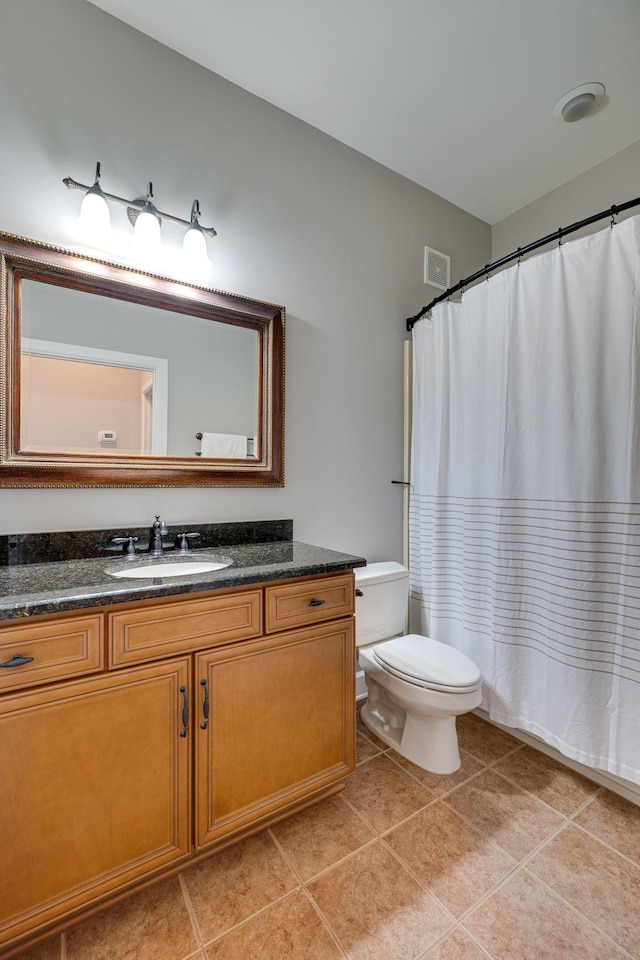 305 Seven Springs Way Unit 401, Brentwood, TN 37027 - bathroom featuring tile patterned flooring, toilet, a shower with shower curtain, visible vents, and vanity