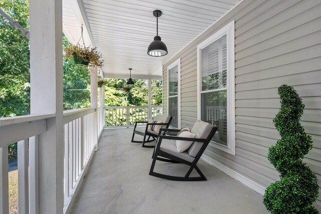 view of patio featuring a porch