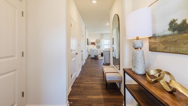 hallway featuring dark wood-type flooring and recessed lighting