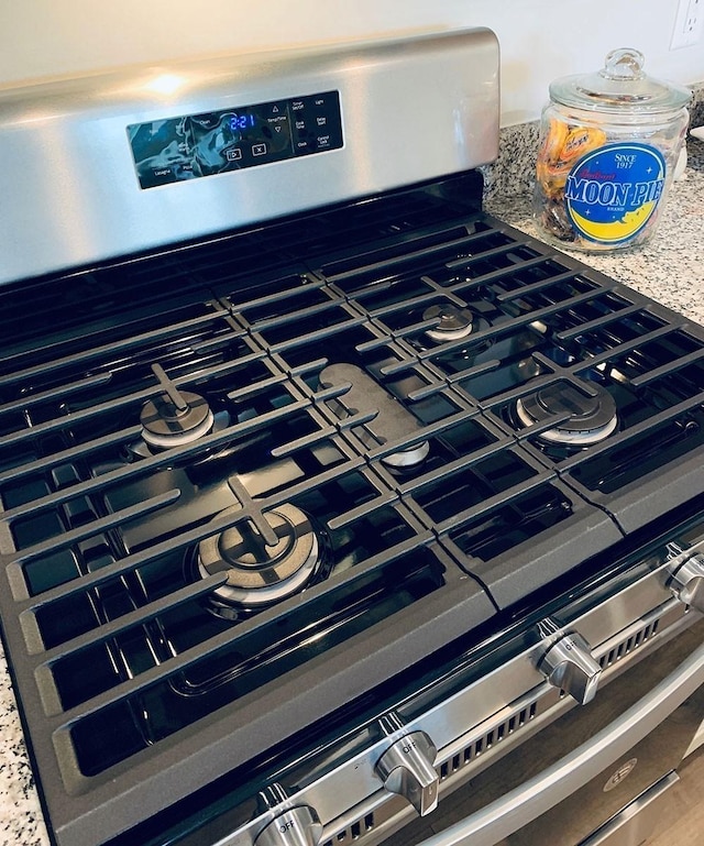 room details with stainless steel range with gas cooktop