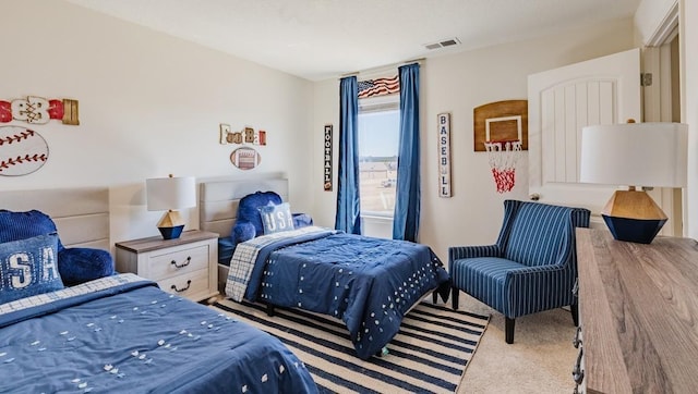 carpeted bedroom featuring visible vents