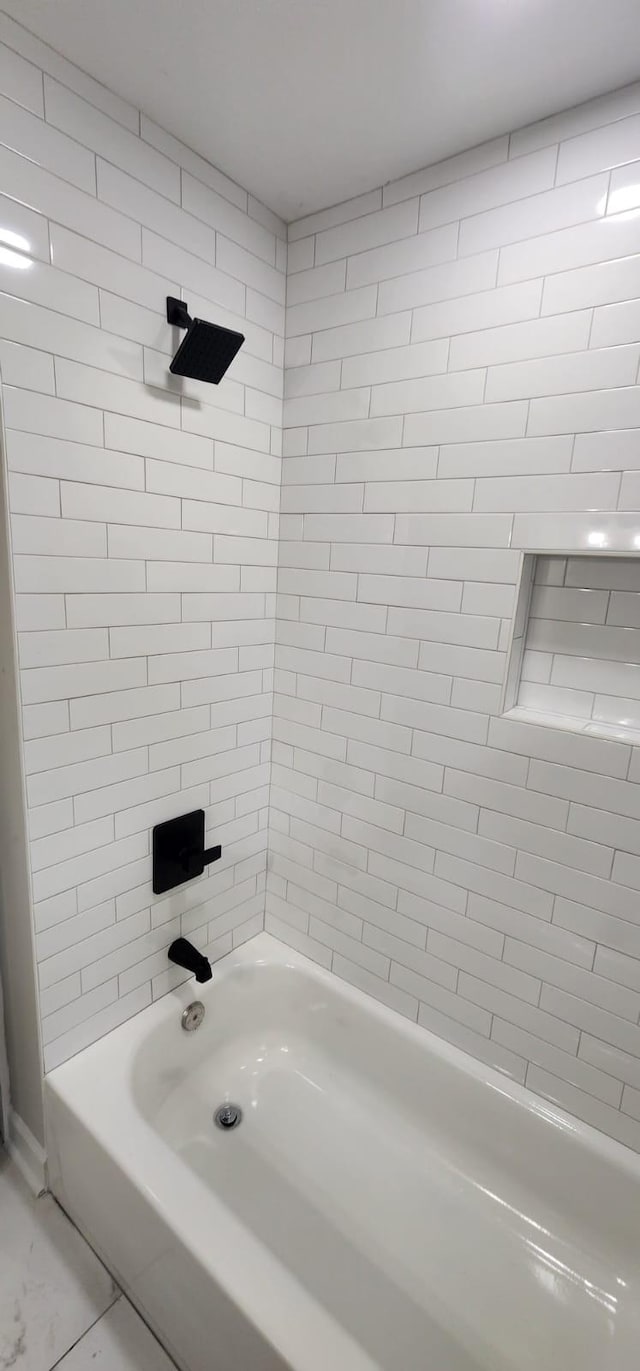 full bath featuring bathtub / shower combination