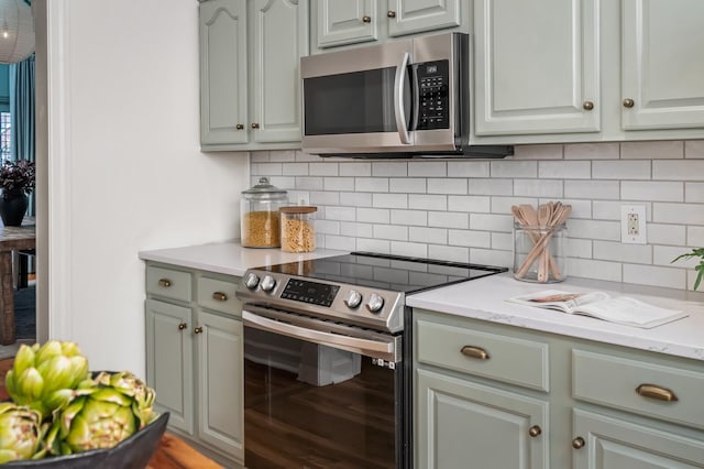 kitchen featuring stainless steel appliances and backsplash