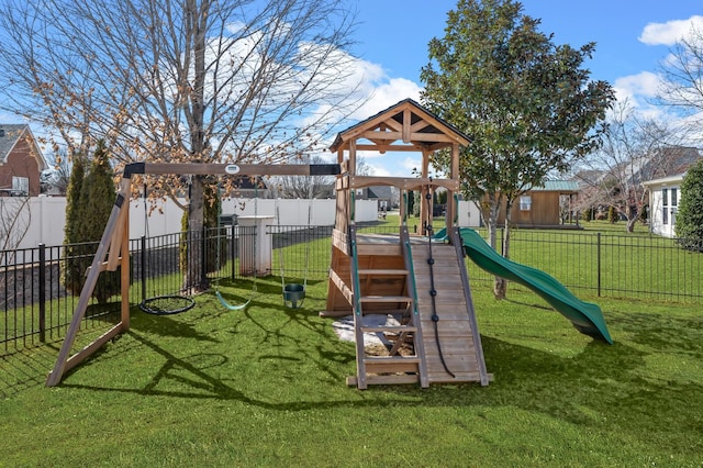 view of jungle gym with fence and a lawn