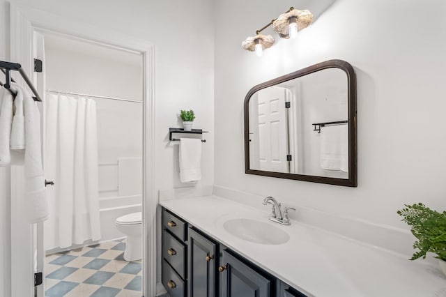 bathroom featuring toilet, tile patterned floors, shower / tub combo, and vanity