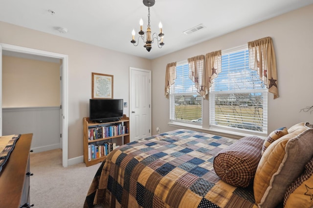 bedroom featuring light carpet, a chandelier, visible vents, and baseboards