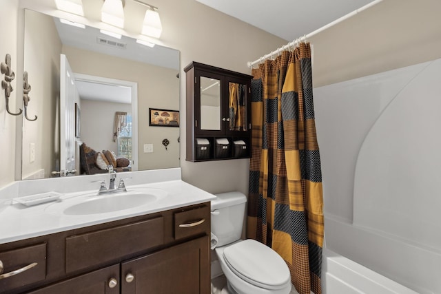 bathroom featuring visible vents, vanity, and toilet