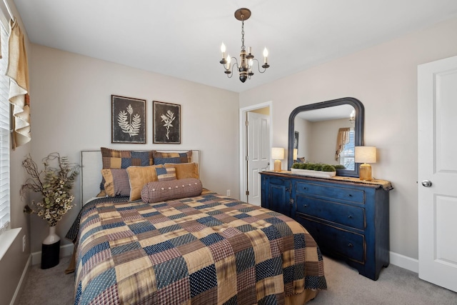 bedroom with baseboards, a chandelier, and light colored carpet