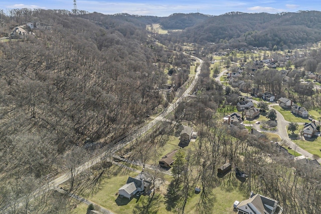 drone / aerial view with a wooded view