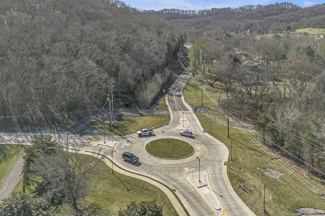 aerial view featuring a wooded view