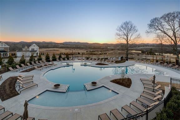 pool with fence and a patio