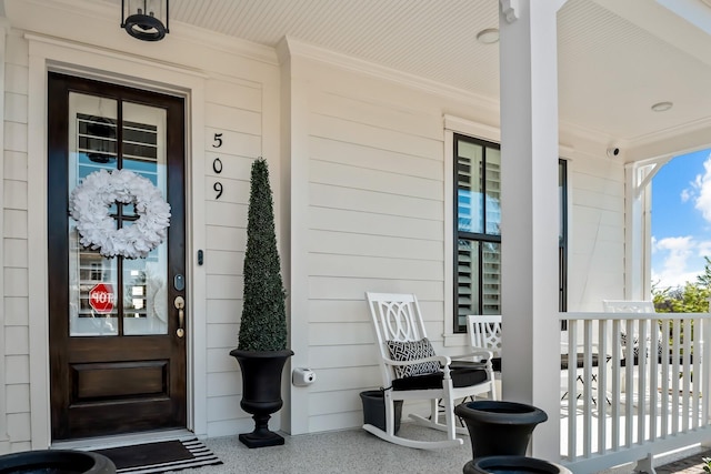 property entrance with covered porch