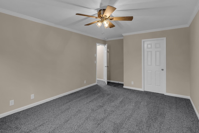 unfurnished bedroom featuring a ceiling fan, baseboards, dark colored carpet, and crown molding