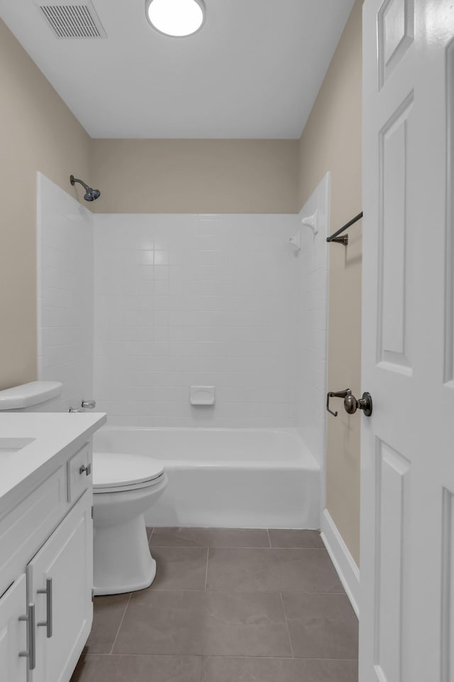 bathroom with shower / washtub combination, visible vents, toilet, vanity, and tile patterned flooring