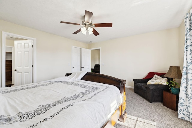 carpeted bedroom featuring a ceiling fan and baseboards