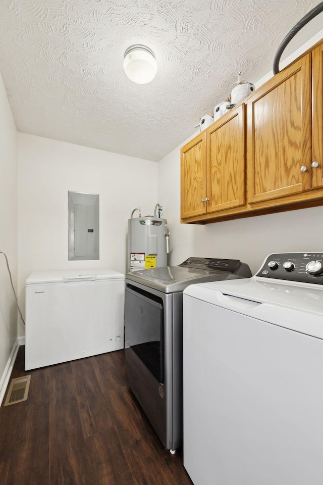 laundry room with electric water heater, visible vents, washer and dryer, cabinet space, and electric panel