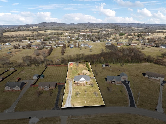 drone / aerial view featuring a rural view and a mountain view