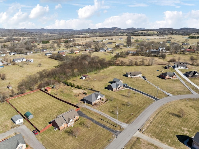 bird's eye view featuring a mountain view and a rural view