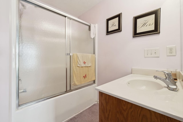 bathroom featuring enclosed tub / shower combo and vanity