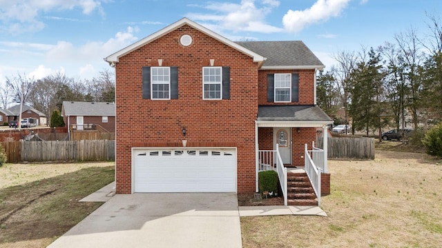 traditional-style home featuring driveway, an attached garage, fence, and brick siding