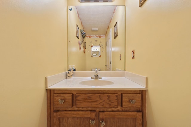 bathroom featuring visible vents and vanity