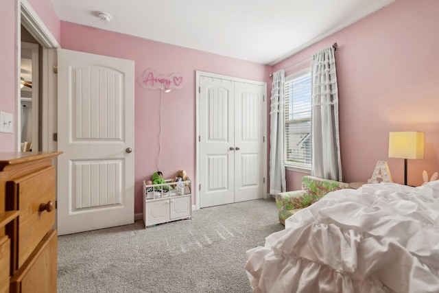 carpeted bedroom featuring a closet