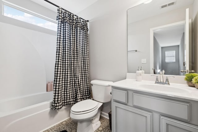 full bath with toilet, a healthy amount of sunlight, visible vents, and shower / tub combo with curtain