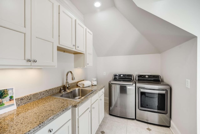 laundry area with recessed lighting, baseboards, washing machine and dryer, a sink, and light tile patterned flooring