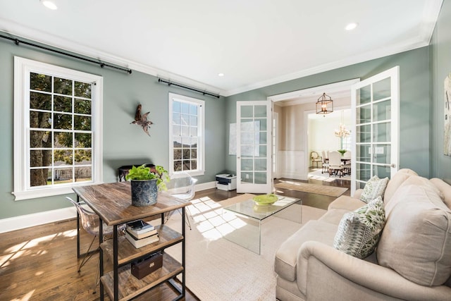 interior space with a chandelier, a wealth of natural light, and french doors