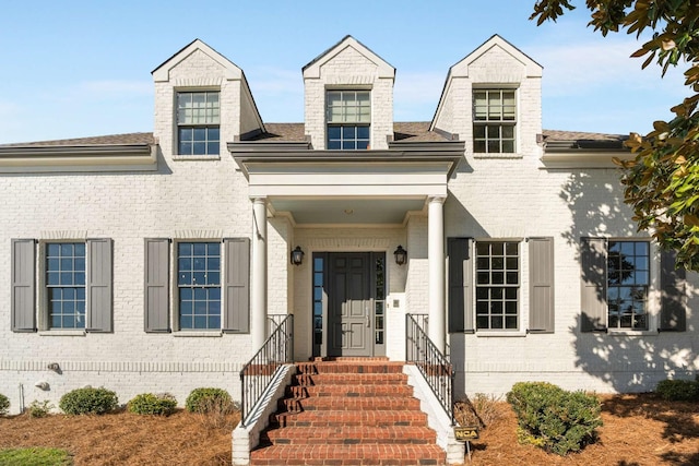 cape cod house with brick siding