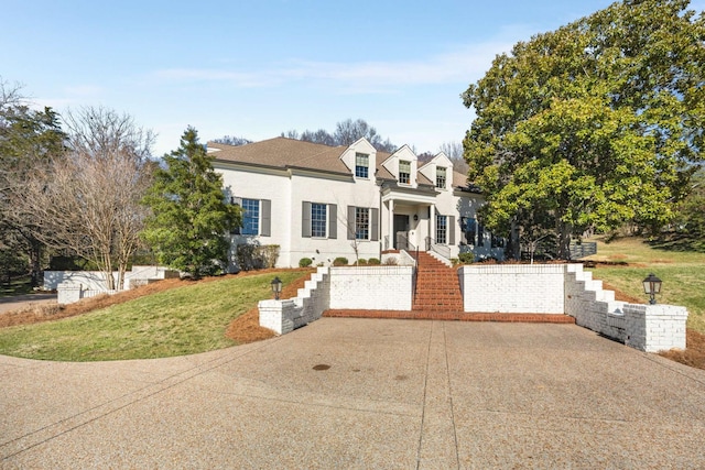 view of front of property with a front lawn and stucco siding