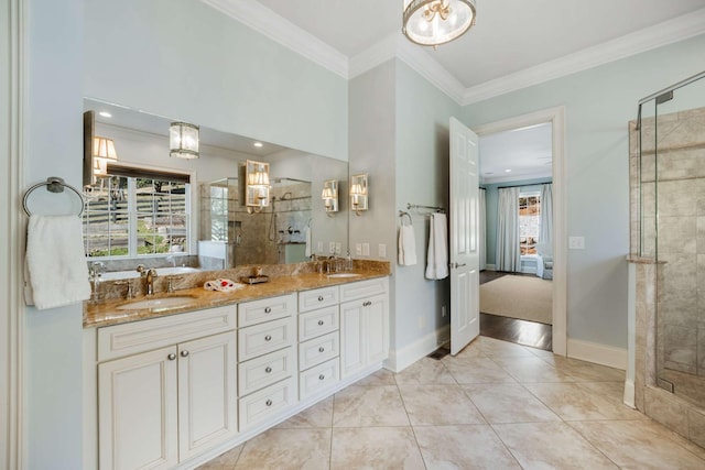 ensuite bathroom featuring ornamental molding, ensuite bath, a sink, and a stall shower