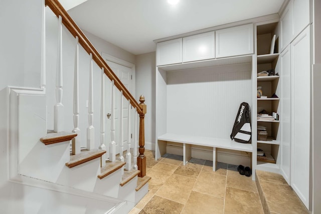 mudroom with stone finish floor