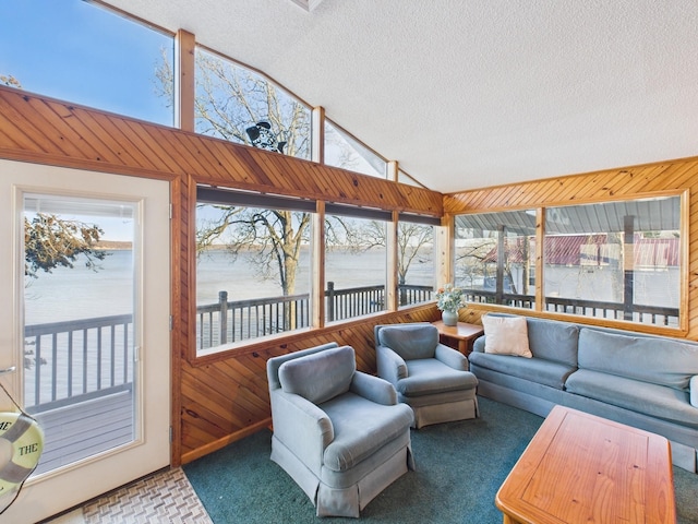 sunroom featuring vaulted ceiling