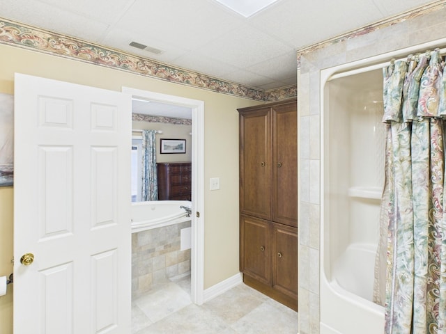 full bath with baseboards, visible vents, and tile patterned flooring